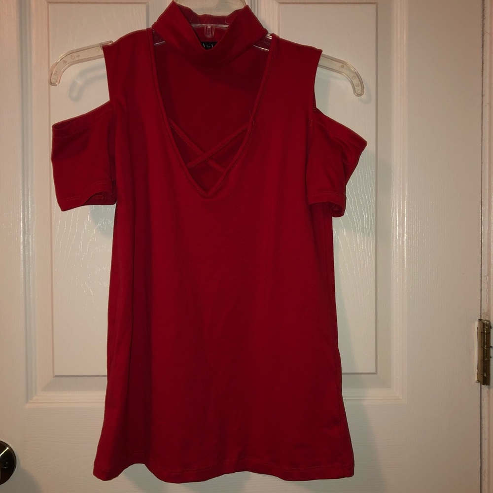 Red shirt. Size small. Neck high. Open shoulders.